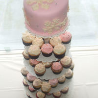 Wedding Cake With Cupcakes This is a 6in round topper cake with a bunch of matching cupcakes. The wedding was a winter theme, white chocolate snowflakes, I used...