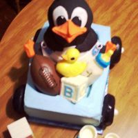 Penguin Baby Shower Theme This was a baby shower cake for a relative who loves penguins!The penguin was baked in the Wilton Stand Up Bear Pan and ears trimed off,...