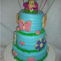 Tara's Butterflies, Flowers & Hearts A repeat request from my 6yo. This was a cake I made for her when she celebrated four. A variation of Wilton's 2004 "Spreading...