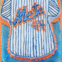Dsci0773.jpg birthday cake made for a met's fan...used the wilton t-shirt pan...mets logo made with piping gel transfer...sheet cake is vanilla...