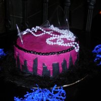 Sex And The City Theme iced in buttercream...fondant skyline..plastic martini glass and pearls i did not roll my fondant thin enough so it ended up a little bulky...