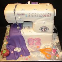 Singer Sewing Machine Entire sewing machine is cake - even the top part. All the accessories are gumpast/fondant. All edible except for the two wooden skewers on...