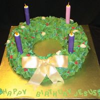Advent Wreath 16" cake with an 8" cake cut out of the middle. I carved down the corners to make it round and then applied about 50 million...