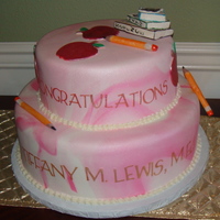 Graduation Cake 2 tier cake for a young lady who received her M.Ed, and wanted the cake decorated with an educator's theme...complete with pencils,...