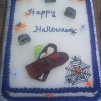 Not So Scary Halloween Cake This is a cake a customer ordered. She wanted white icing with purple border and fondant accents. The pumpkins,ghosts, and little green...