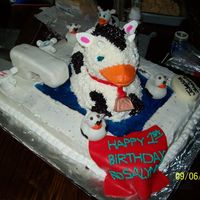 100_0575.jpg This is a cow duck cake i made for my neices first birthday...all buttercream, faucet made out of rice krispies treats and covered in...