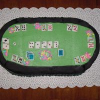 Texas Holdem Poker Cake It's an 8" square and an 8" round cut in half to make an oval, buttercream with fondant rail, fondant cards, and candy chips...