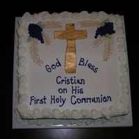 First Communion White cake, pineapple filling, fluffy buttercream frosting. Used fondant with metallic luster dust painted on for the cross
