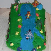 Pooh And Friend Cake Pooh an d friends on water slide. Cake yellow cake with buttercream icing, flowers with royal icing, Pooh characters.