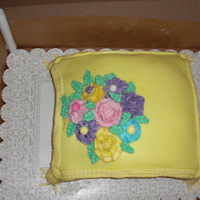 Yellow Pillow Cake pillow cake, made with fondant icing , and buttercream frosting flowers