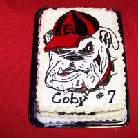 Georgia Bulldogs..dawg I traced the picture on parchment paper, outlined it in black royal icing and then filled in the red with cookie icing ..I let it harden...