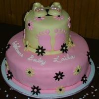 Baby Shower Cake Lemon cake covered with MMF and candy shoes.