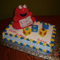 Elmo Elmo is made from the stand up bear pan. All cakes are choc. Blocks are golden. Iced in bc, eyes and sign are fondant. Numbers/letters are...