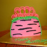 Pink Bratz Purse Chocolate cake with BC icing. Chocolate candy melts handle with child's name in it. Also went with pink cupcakes with choc. candy...