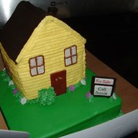 For A Lady Who Just Got Her Realtors License Carved house with buttercream and fondant accents.