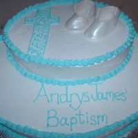 Andrys' Baptism Baby boy baptism cake. Booties made from gumpaste and sprayed with pearl luster by bakery crafts.