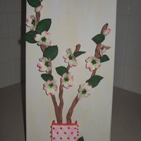 Dogwood Picture i made this from an idea i had to actually make a wall hanging from gumpaste flowers. everything is made from gumpaste except for the...