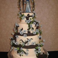 Corpse Bride Wedding Cake 4 tiers, top was foam, white cake with buttercream. trellis made out of wire with tootsie rolls on it it. then wrapped with ivy vines and...