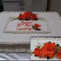 80Th Birthday Cake white cake with rasberry filling. buttercream frosting. gumpaste flowers and leaves. rice paper butterfly.