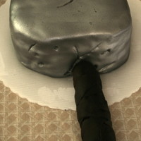Thor's Hammer White cake covered with fondant, handle was rice krispies. Was second cake for a four cake stacked cake to be entered in a cake show in...