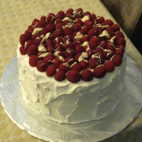 White Chocolate Raspberries French vanilla cake filled with raspberry filling, covered in white chocolate buttercream and topped with fresh raspberries drizzled with...
