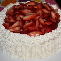 Strawberry Whipped Cream Cake Vanilla whipped cream sponge cake with whipped cream and cream cheese frosting, topped and filled with fresh strawberries.