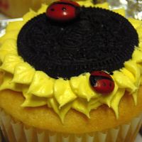 Sunflower Ladybug Baby Shower strawberry filled white cake with butter cream. oreos for the center and m&m's for the ladybugs