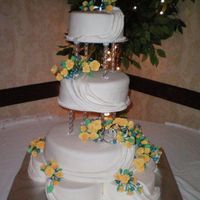 Yellow Roses This is a cake I did this weekend for a friends wedding. It is buttercream then covered in Satin Ice. The flowers are all gumpaste made by...