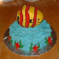 Fish Cake Two layer white base cake w/ a chocolate carved ball cake for the fish. All decorated in BC frosting.