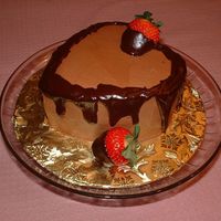Choclate Chocolate Two layer chocolate cake with chocolate BC frosting and ganache dipped strawberries.
