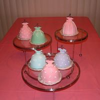 Dress Up Mini Wondermold chocolate cakes w/ BC underneath MMF. Bodices in MMF and other accents in royal icing. These cakes were done for my 4 year...