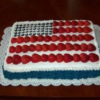 4Th Of July This cake was made with buttercream, strawberry mousse filling, strawberries and blueberries.