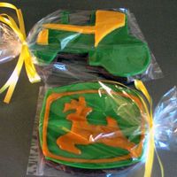 John Deere Cookies Rolled chocolate sugar cookie with MMF as a base with royal icing deere accents.
