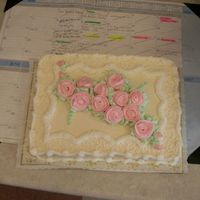 Pretty In Pink Ivory cake with pink flowers, made for a doll club meeting.