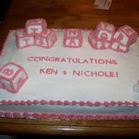 Baby Block Cake The cake is made half of chocolate and yellow cake. The baby blocks are strawberry cake covered in Fondant and stacked on top. It was lots...