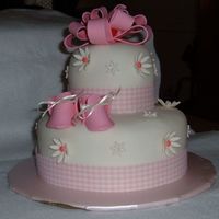 Baby Shower An 8" and 4" round, covered in MMF with gumpast decorations and ribbon around bottom. Based on cake by Suzy40. Thanks for looking...