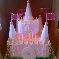 Castle Cake buttercream cake embossed with stone impression mat...with sugar cones iced in buttercream and rolled in sugar turret toppers
