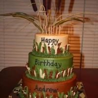 Camo Cake 3 teired chocolate cake with chocolate filling - I used a leave tip and grass tip for borders and used parts of an artificial cattail...