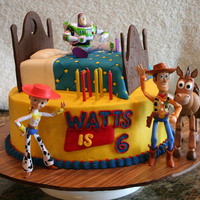 Toy Story Birthday Cake buttercream cake with figurines supplied by parents - bed made of cake covered with fondant embossed and accented with sprinkles. Head...