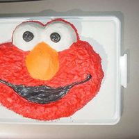 Elmo This was the 1st Elmo cake I did for my Godson's birthday. It is white cake iced in all BC. I did extra cupcakes to match (see next...