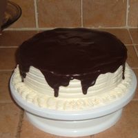 Ganache Cake This is the first time using Ganache.. it was super easy.. next time i have to make the top look smoother.. the cake is a chocolate cake...