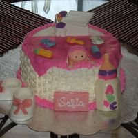 Baby Shower Cake Vanilla Butter cake with white chocolate buttercream. All accessories are white chocolate made from molds with the exception of the baby...