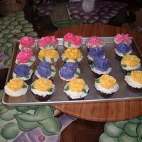 Flower Cupcakes This is a mix of vanilla and chocolate cupcakes with italian merinque icing and flowers