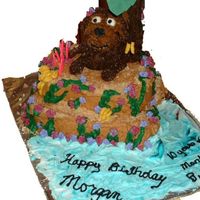 Monkey This monkey was done by using a mini bear pan. we also baked a 12x18 broke the peices and stacked like an island iced and added grahm...