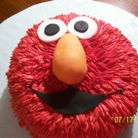 Elmo Birthday Cake 2 layer 8 inch round. Fondant covered RKT nose and fondant mouth and eyes