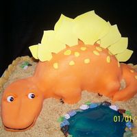 Orange Dinosaur By Pond Idea for cake taken from wonderful pictures on CC.Used 7 egg pound cake to make the 8" round that I used for the body and covered in...