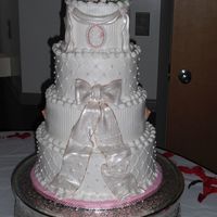 Pink Wedding Client wanted bows and pink flowers. All gumpaste fondant accents.