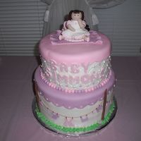 Clothesline Baby Fondant accents. Client wanted purples..pinks and white.