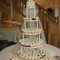 Cupcake Wedding 252 cupcakes & 6" cake on top with Nicole's grandmother's cake topper that was 60 yrs. old for Nick & Nicole , cake...