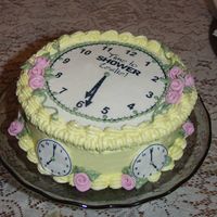 Shower Time 10" round cake, fresh lemon with fresh lemon BC icing. Edible image accents and fondant ribbon roses. Gumpaste circles to hold the...